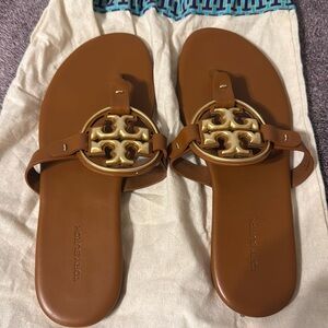 Brown and gold Miller Tory Burch sandals.